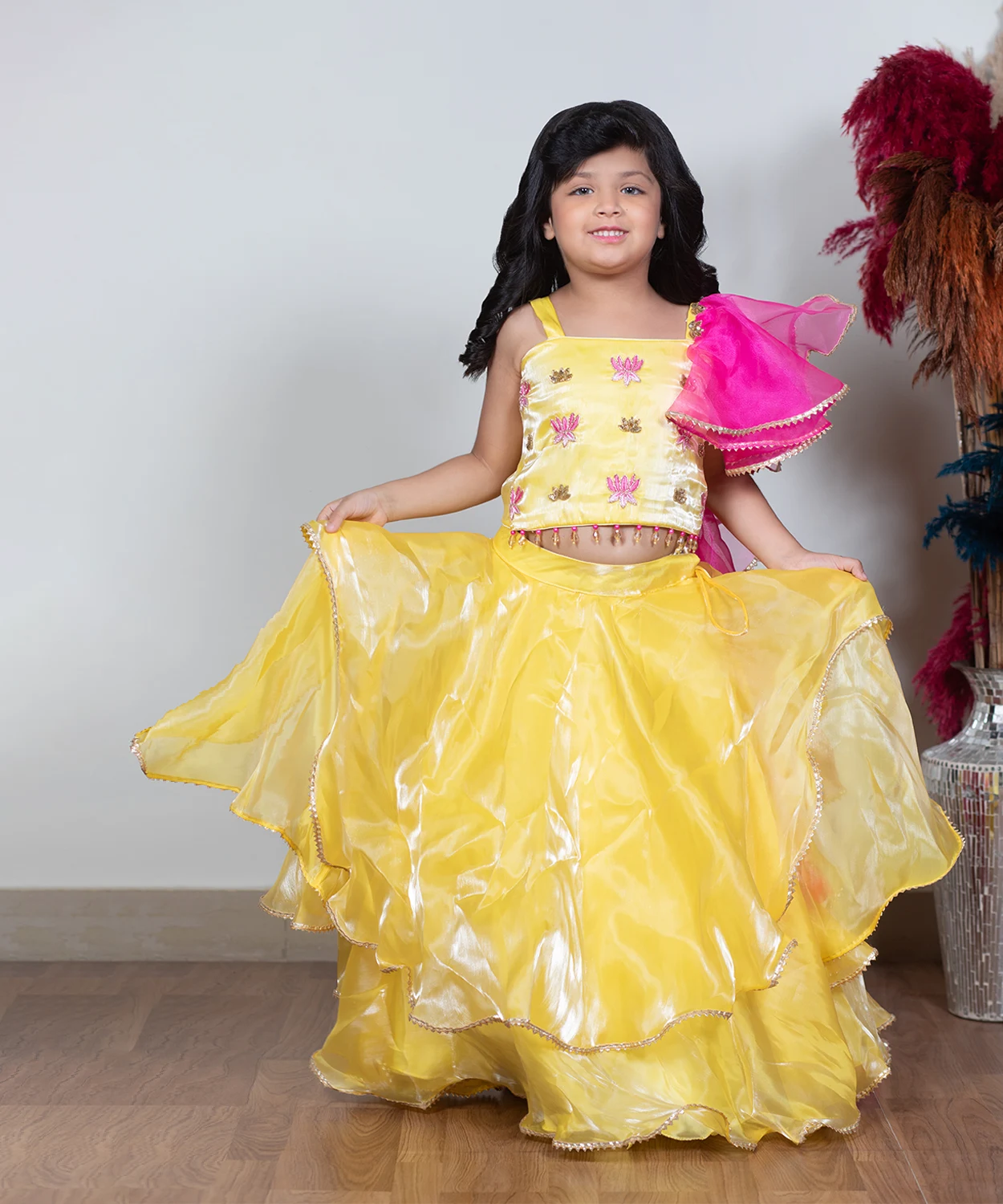 Yellow Lehenga Paired With A Vibrant Pink Dupatta