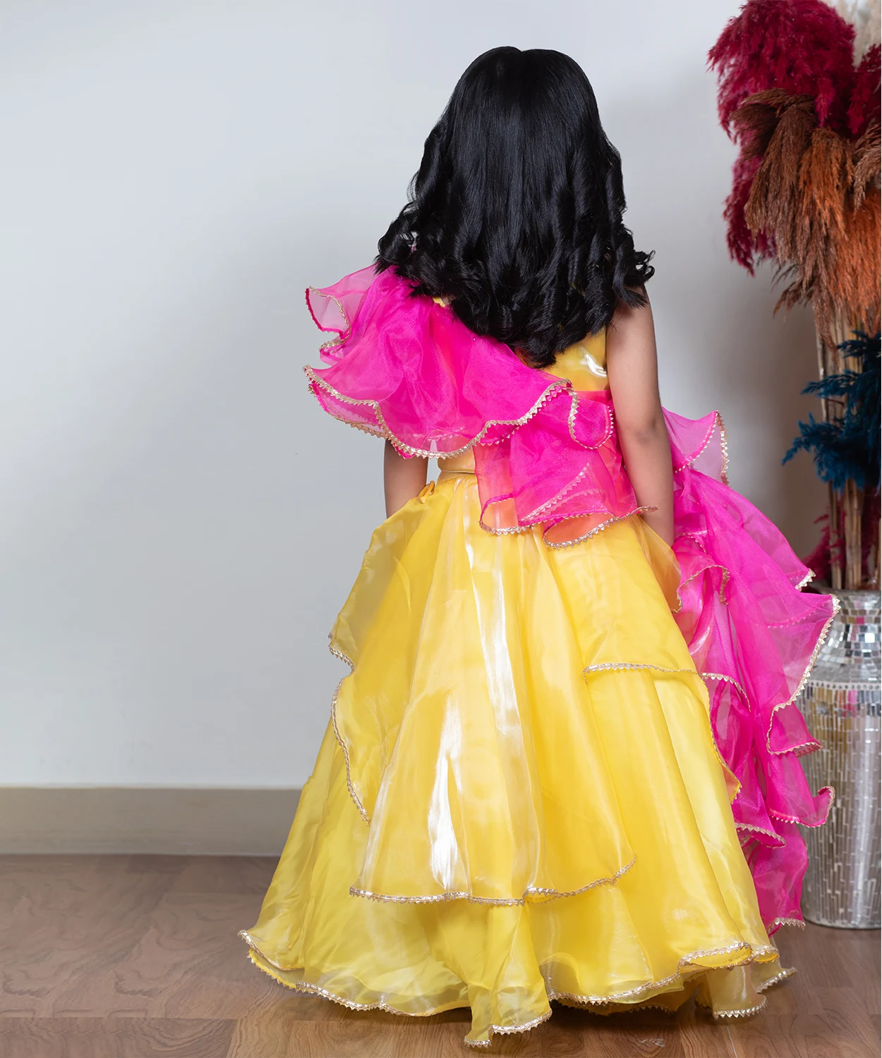 Yellow Lehenga Paired With A Vibrant Pink Dupatta