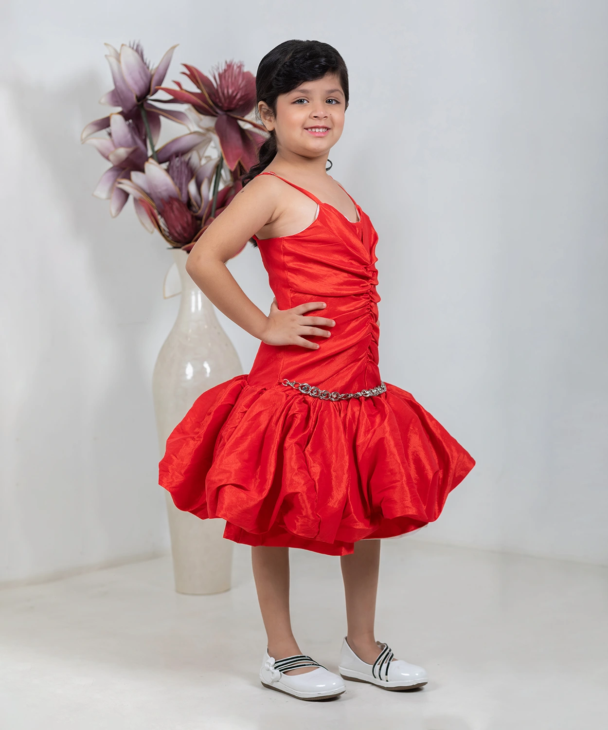 A Shimmery Orange Dress With A Unique Silhouette