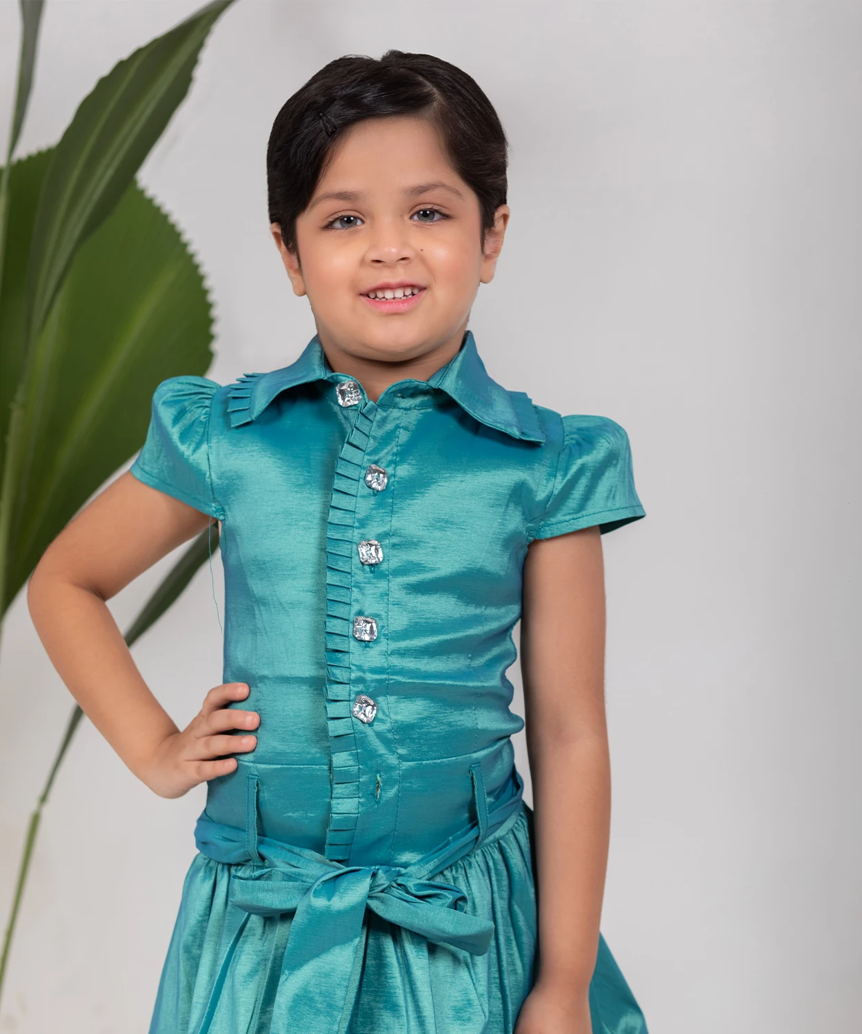 A Shiny Green Dress With A Smart Collar