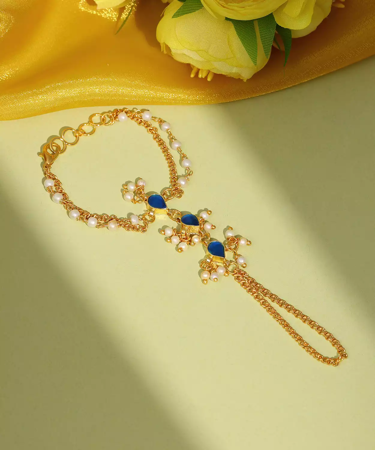 Kids Kundan Blue Stone Haath Phool In Gold Plated Brass With Pearls